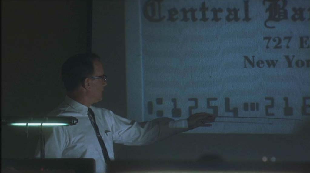 F.B.I. agent Carl Hanratty shows codeline with the E13B banking font on check
